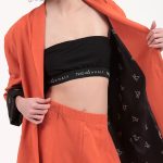 UNISEX BLAZER WITH OVERSIZED SHOULDERS AND LOGO BUTTON DETAIL — ORANGE