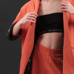UNISEX BLAZER WITH OVERSIZED SHOULDERS AND LOGO BUTTON DETAIL — ORANGE