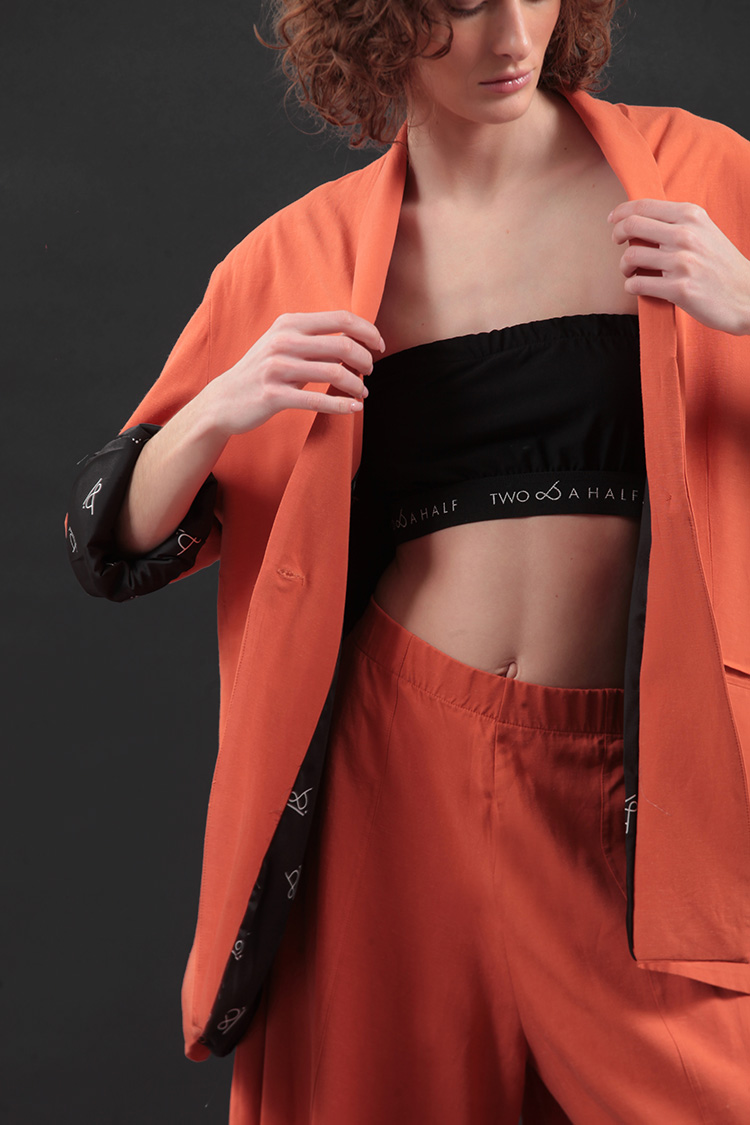 UNISEX BLAZER WITH OVERSIZED SHOULDERS AND LOGO BUTTON DETAIL — ORANGE