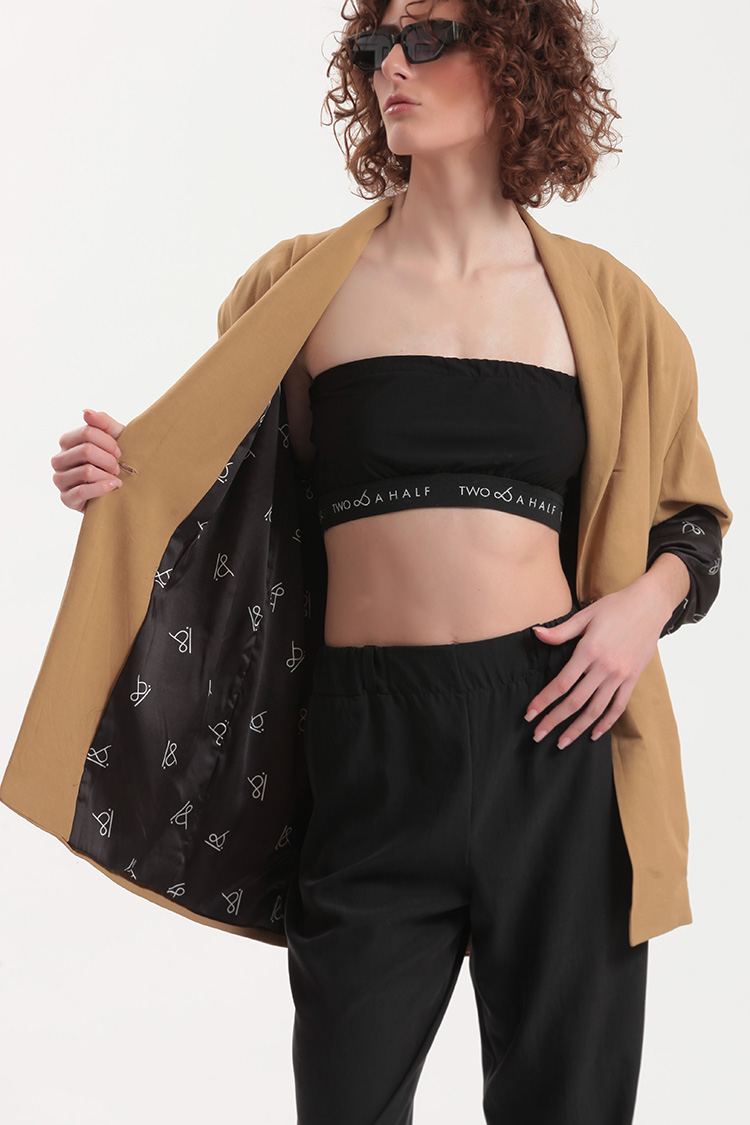 UNISEX BLAZER WITH OVERSIZED SHOULDERS AND LOGO BUTTON DETAIL — BEIGE